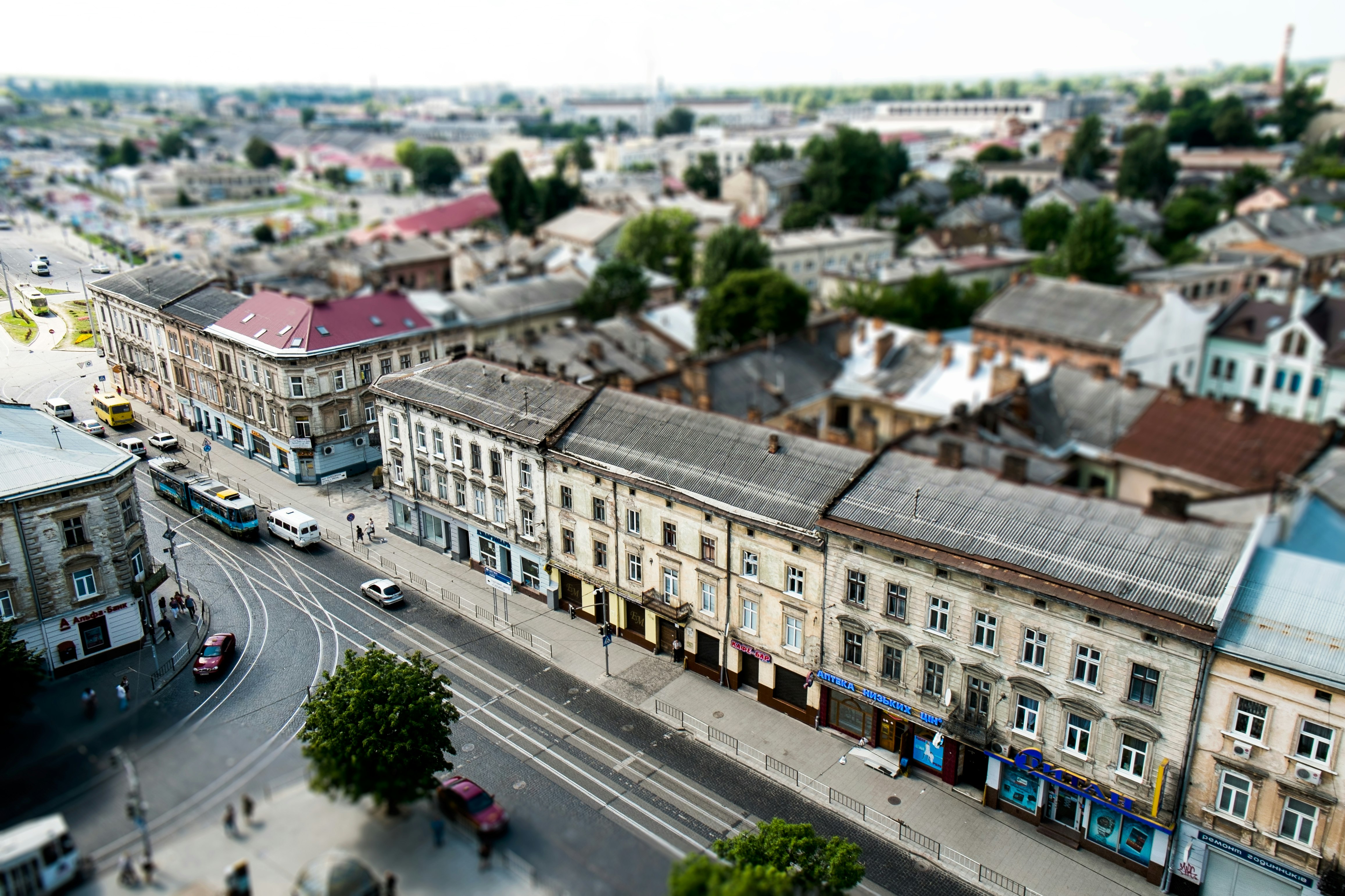 high angle view of cars on road between buildings